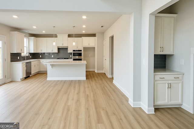 3468 Jasmine Way SW, South Fulton, GA 30331 - kitchen featuring appliances with stainless steel finishes, tasteful backsplash, a sink, light countertops, and recessed lighting