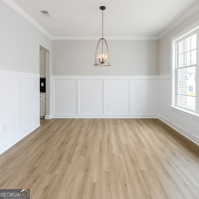 3468 Jasmine Way SW, South Fulton, GA 30331 - unfurnished dining area featuring a decorative wall, a chandelier, crown molding, light wood-type flooring, and a wainscoted wall