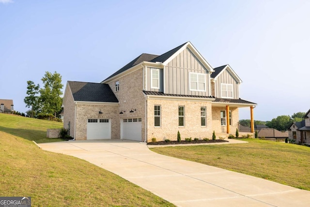 982 Wildberry Ct, Jefferson, GA 30549 - view of front of home with board and batten siding, concrete driveway, a front lawn, and brick siding