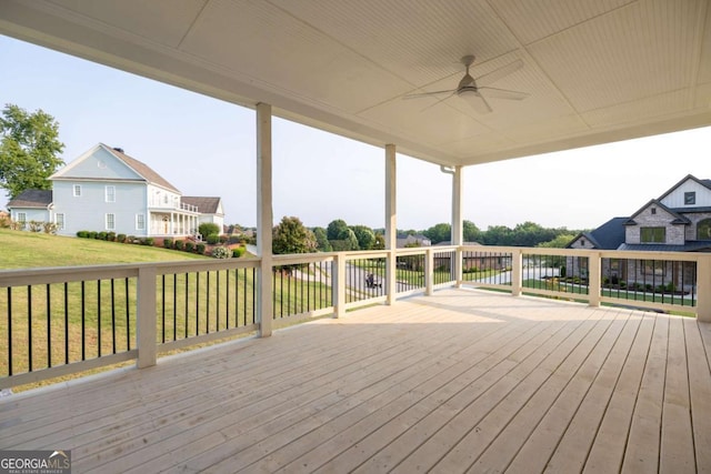 982 Wildberry Ct, Jefferson, GA 30549 - wooden terrace featuring a ceiling fan, a yard, and a residential view