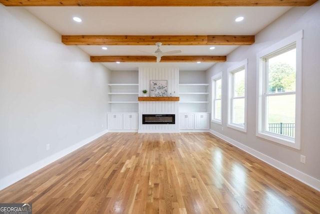 982 Wildberry Ct, Jefferson, GA 30549 - unfurnished living room featuring baseboards, light wood-style floors, recessed lighting, a large fireplace, and built in features