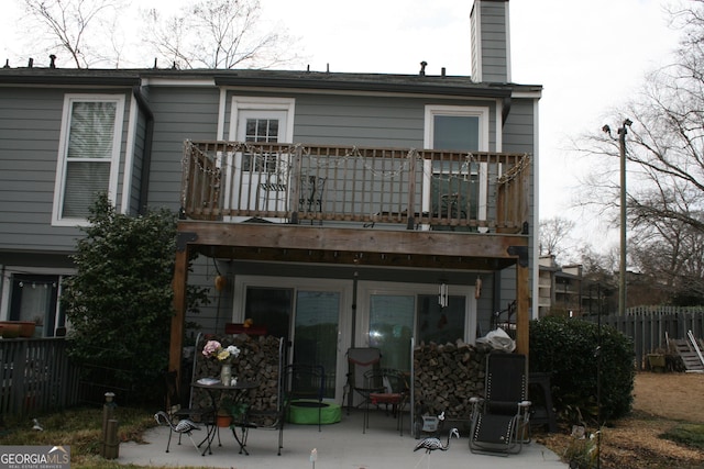 1026 Riverbend Club Dr, Atlanta, GA 30339 - rear view of house with a patio area, a chimney, and a deck