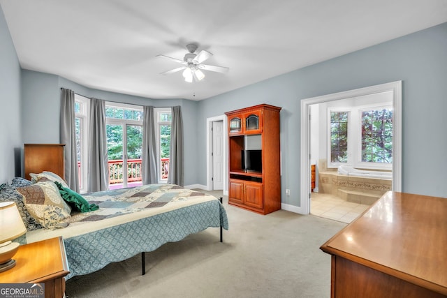 242 Pristine Cv, Hartwell, GA 30643 - bedroom featuring light colored carpet, baseboards, connected bathroom, and a ceiling fan