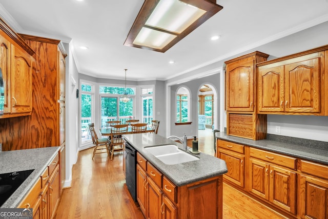 242 Pristine Cv, Hartwell, GA 30643 - kitchen with a sink, crown molding, an island with sink, black appliances, and brown cabinetry
