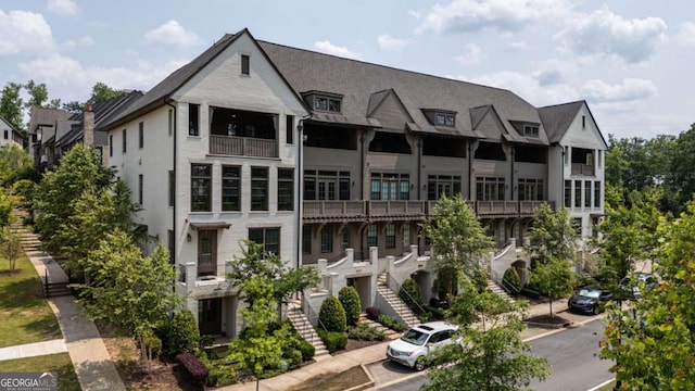 6613 Encore Blvd, Atlanta, GA 30328 - view of building exterior featuring stairs and uncovered parking