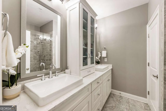 6613 Encore Blvd, Atlanta, GA 30328 - full bathroom with double vanity, a shower stall, marble finish floors, and baseboards