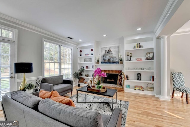 4901 Briarleigh Chase SW, Mableton, GA 30126 - living area with crown molding, ornate columns, wood finished floors, plenty of natural light, and built in features