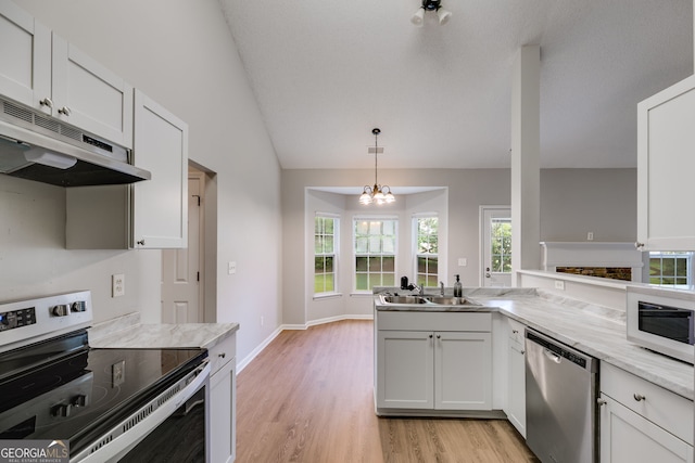 305 Overland Trl, Temple, GA 30179 - kitchen with appliances with stainless steel finishes, under cabinet range hood, a sink, light wood finished floors, and healthy amount of natural light