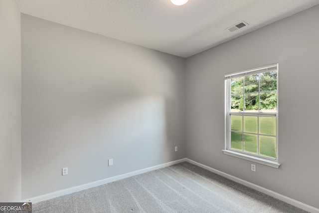 305 Overland Trl, Temple, GA 30179 - carpeted empty room with baseboards and a textured ceiling