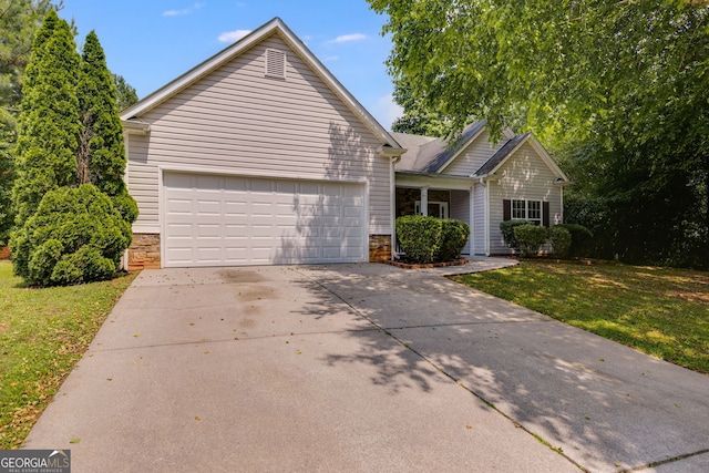 305 Overland Trl, Temple, GA 30179 - ranch-style home with stone siding, concrete driveway, a front yard, and a garage