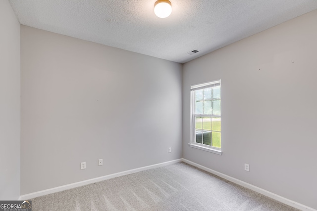 305 Overland Trl, Temple, GA 30179 - carpeted spare room featuring a textured ceiling and baseboards