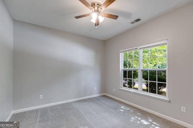305 Overland Trl, Temple, GA 30179 - carpeted empty room featuring baseboards, a ceiling fan, and a textured ceiling