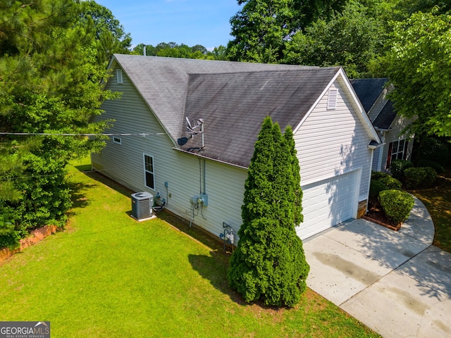 305 Overland Trl, Temple, GA 30179 - view of side of property with driveway, a yard, roof with shingles, and an attached garage