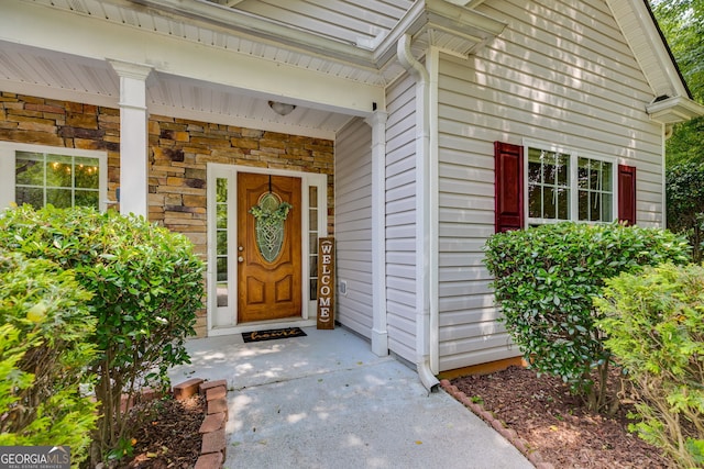 305 Overland Trl, Temple, GA 30179 - view of exterior entry featuring stone siding and a porch