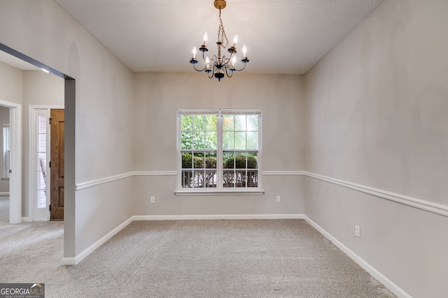 305 Overland Trl, Temple, GA 30179 - unfurnished room featuring a chandelier, carpet flooring, a textured ceiling, and baseboards