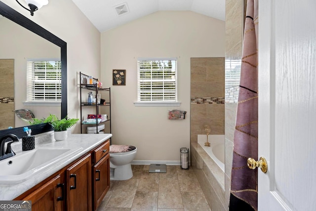 8180 Chapman Ter, Mcdonough, GA 30252 - full bath featuring vanity, vaulted ceiling, and tiled shower / bath combo