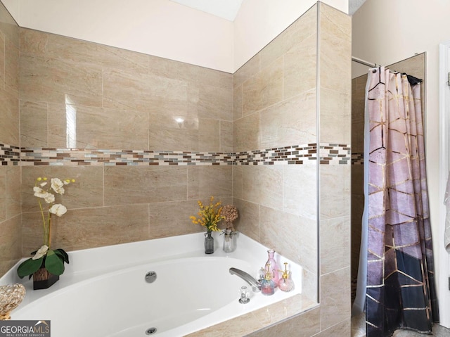 8180 Chapman Ter, Mcdonough, GA 30252 - bathroom with a garden tub and a tile shower