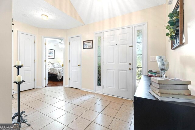 8180 Chapman Ter, Mcdonough, GA 30252 - foyer entrance featuring light tile patterned floors and baseboards
