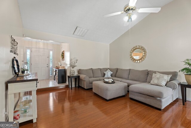 8180 Chapman Ter, Mcdonough, GA 30252 - living room featuring vaulted ceiling, wood finished floors, and ceiling fan