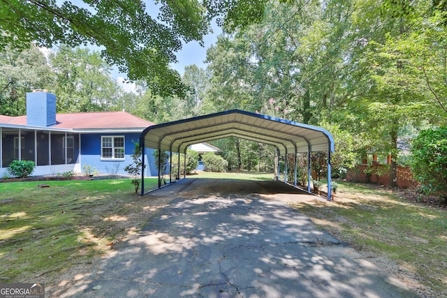 766 Blanton Blvd, Macon, GA 31210 - view of parking with asphalt driveway and a detached carport