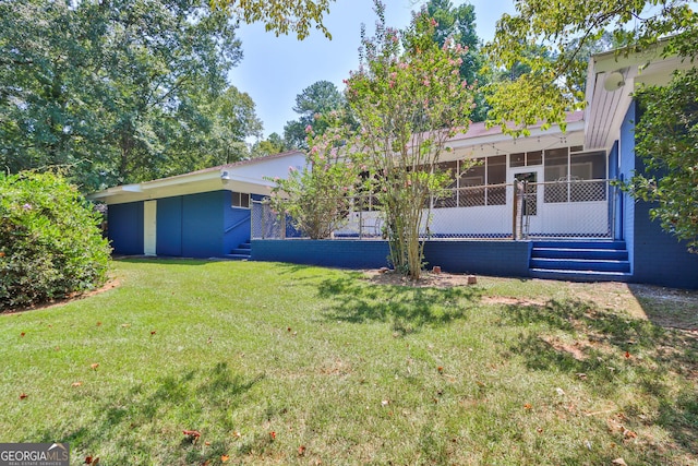 766 Blanton Blvd, Macon, GA 31210 - back of property featuring a sunroom and a lawn
