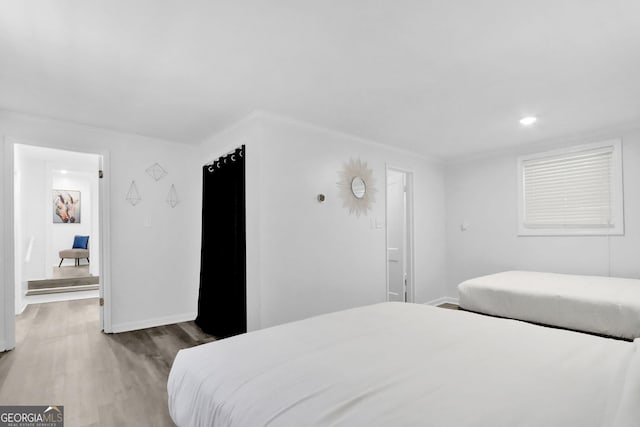 766 Blanton Blvd, Macon, GA 31210 - bedroom featuring wood finished floors, baseboards, recessed lighting, and ensuite bath