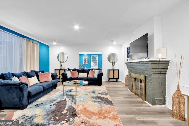 766 Blanton Blvd, Macon, GA 31210 - living room featuring a fireplace, wood finished floors, ornamental molding, recessed lighting, and baseboards