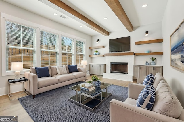 1253 Cumberland Valley Rd, Gainesville, GA 30501 - living area with light wood finished floors, recessed lighting, beamed ceiling, a brick fireplace, and baseboards
