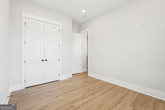 1253 Cumberland Valley Rd, Gainesville, GA 30501 - unfurnished bedroom with light wood-type flooring, baseboards, recessed lighting, and a closet