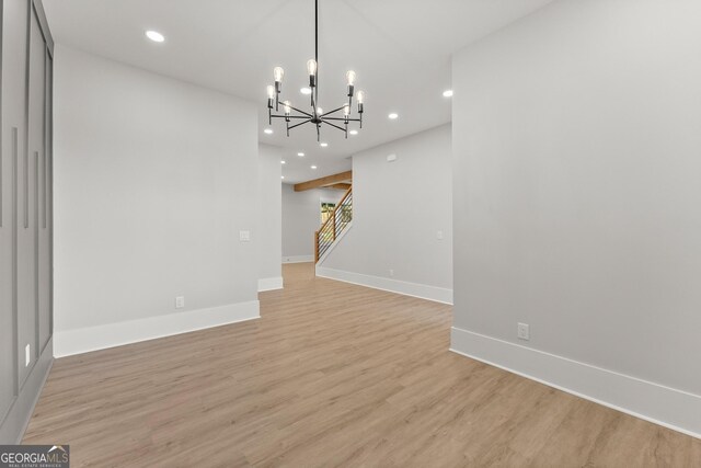 1253 Cumberland Valley Rd, Gainesville, GA 30501 - unfurnished living room with a chandelier, recessed lighting, light wood-style flooring, baseboards, and stairs