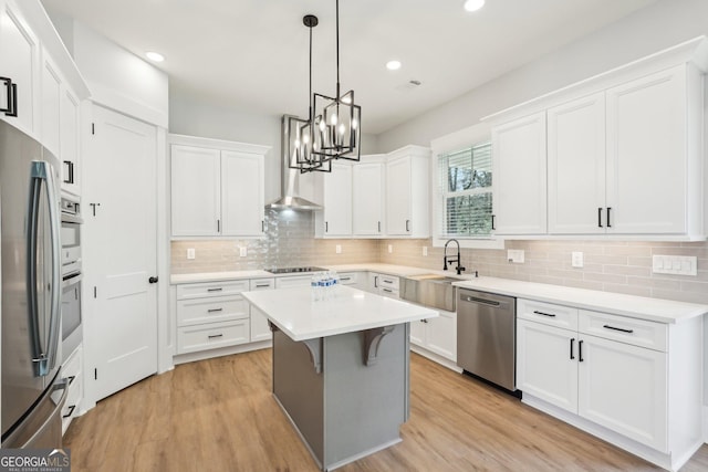 1253 Cumberland Valley Rd, Gainesville, GA 30501 - kitchen with appliances with stainless steel finishes, a chandelier, tasteful backsplash, white cabinets, and recessed lighting