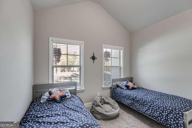 728 Harmony Rd, Temple, GA 30179 - carpeted bedroom featuring lofted ceiling and baseboards