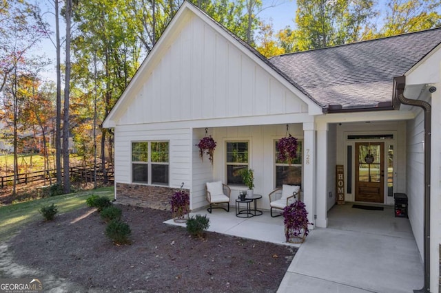 728 Harmony Rd, Temple, GA 30179 - view of front of house featuring board and batten siding, covered porch, and roof with shingles