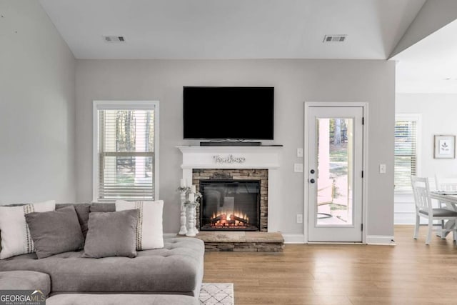 728 Harmony Rd, Temple, GA 30179 - living room with wood finished floors and a stone fireplace