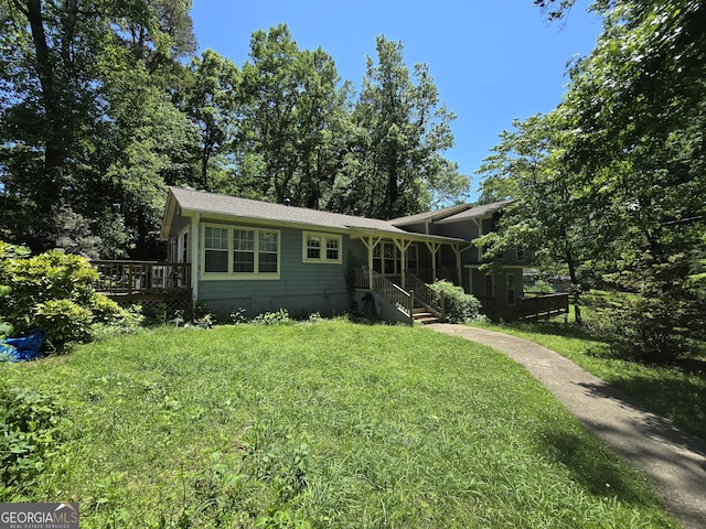 302 Morningside Dr, Clarkesville, GA 30523 - view of front of house featuring a front lawn and a deck