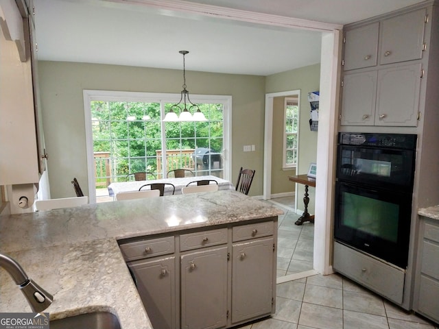 302 Morningside Dr, Clarkesville, GA 30523 - kitchen featuring gray cabinets, light tile patterned flooring, healthy amount of natural light, and a peninsula