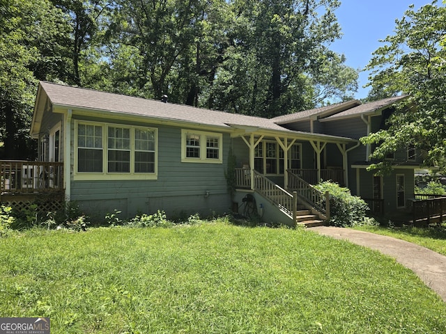 302 Morningside Dr, Clarkesville, GA 30523 - view of front of property with a front lawn, a shingled roof, and a wooden deck