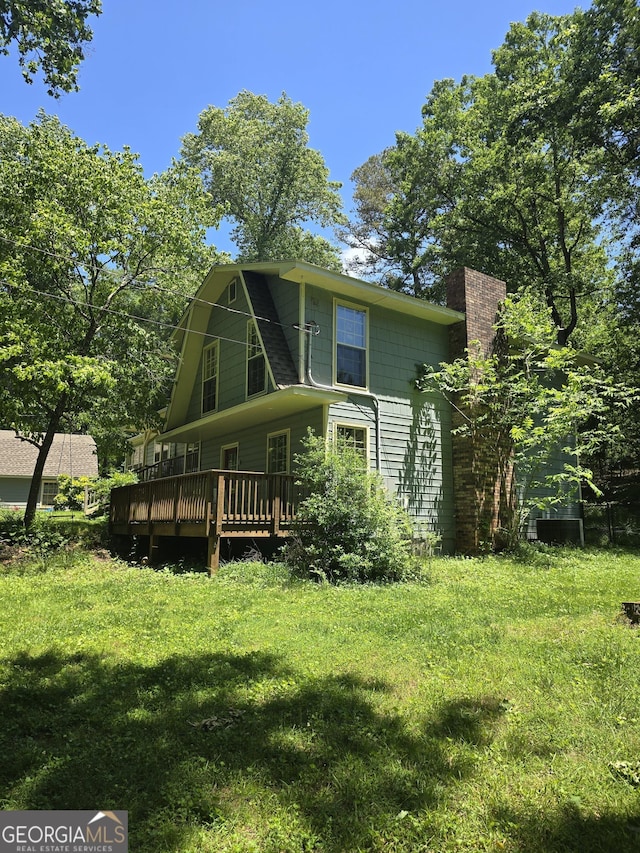 302 Morningside Dr, Clarkesville, GA 30523 - back of property featuring a wooden deck and a chimney