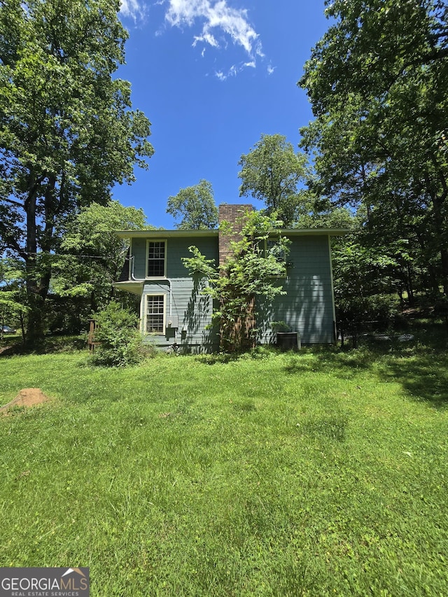 302 Morningside Dr, Clarkesville, GA 30523 - rear view of property featuring a yard