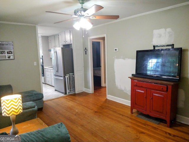 302 Morningside Dr, Clarkesville, GA 30523 - living area featuring crown molding, light wood-type flooring, a ceiling fan, and baseboards