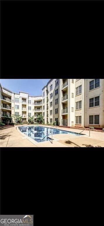 870 Mayson Turner Rd NW Unit 1102, Atlanta, GA 30314 - view of apartment building / complex with a community pool