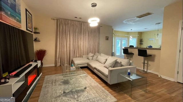 1008 Post Horn Run, Lawrenceville, GA 30045 - living room featuring wood finished floors and baseboards