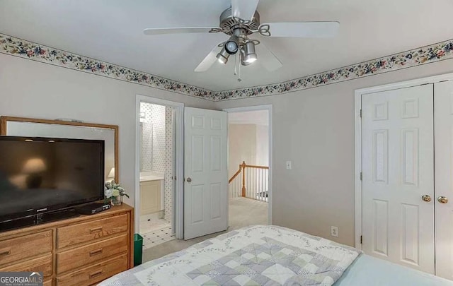 1008 Post Horn Run, Lawrenceville, GA 30045 - bedroom with connected bathroom, ceiling fan, and light colored carpet