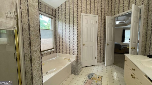 1008 Post Horn Run, Lawrenceville, GA 30045 - ensuite bathroom featuring wallpapered walls, a garden tub, healthy amount of natural light, vanity, and a stall shower