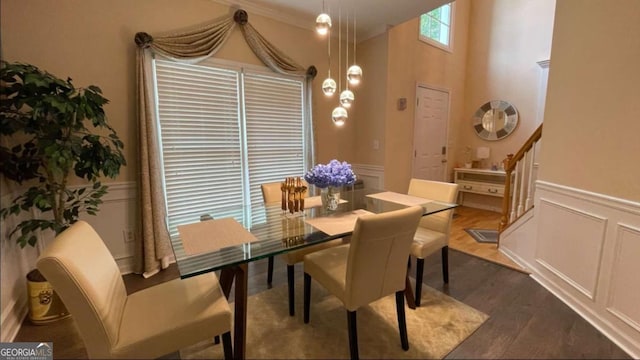 1008 Post Horn Run, Lawrenceville, GA 30045 - dining room with a decorative wall, wainscoting, dark wood-style floors, and ornamental molding