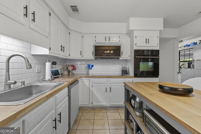 107 Rose Dhu Way, Savannah, GA 31419 - kitchen with black oven, a sink, white cabinets, and decorative backsplash