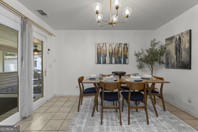 107 Rose Dhu Way, Savannah, GA 31419 - tiled dining area with a textured ceiling, a chandelier, and baseboards