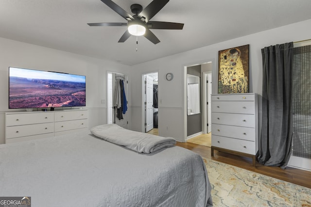 107 Rose Dhu Way, Savannah, GA 31419 - bedroom featuring light wood-style floors, a walk in closet, a ceiling fan, and ensuite bath
