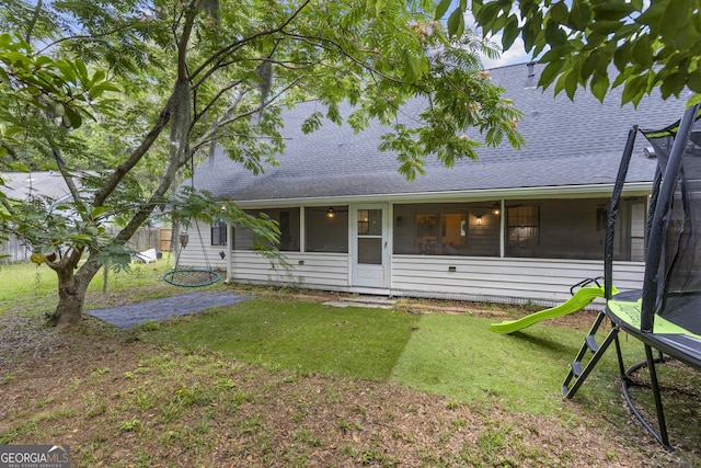 107 Rose Dhu Way, Savannah, GA 31419 - view of front facade with a trampoline, a shingled roof, and a front yard