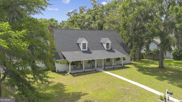 107 Rose Dhu Way, Savannah, GA 31419 - view of front of home featuring a porch, roof with shingles, and a chimney